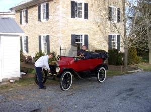Ann cranks while Tom impatiently honks horn